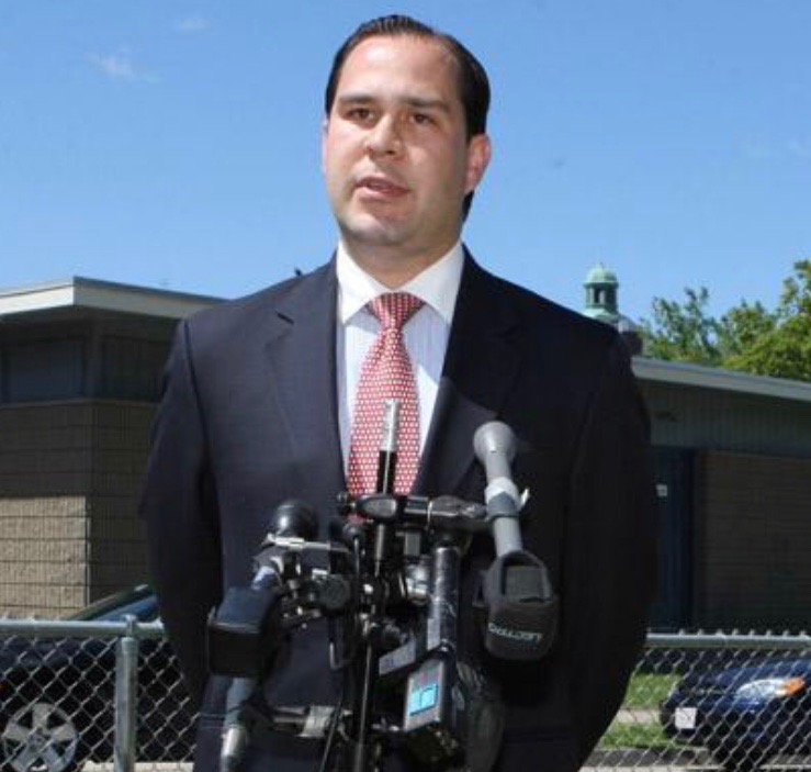 Mayor Flanagan addresses the press outside a Fall River public school